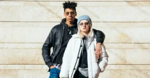 Modern UK fashion trends showing stylish men and women wearing affordable and sustainable British clothing in an urban setting